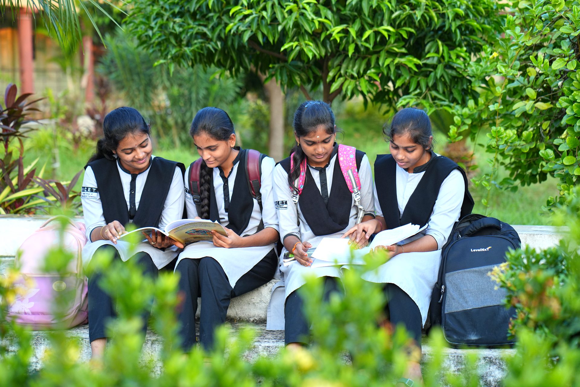 Students reading together in the campus garden